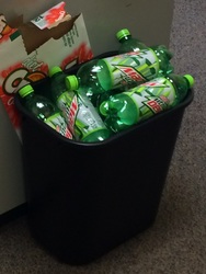 Picture of Mountain Dew in a garbage can.